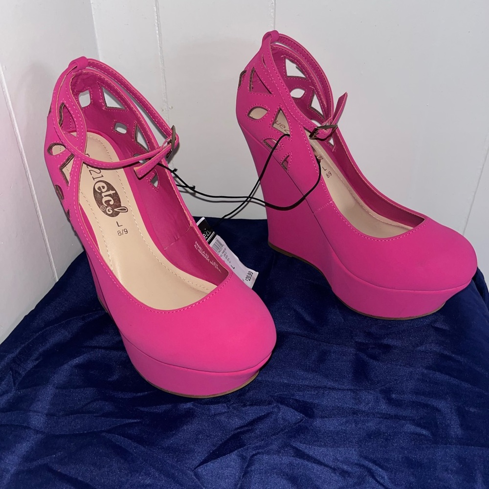 Pink wedge heels with an ankle strap